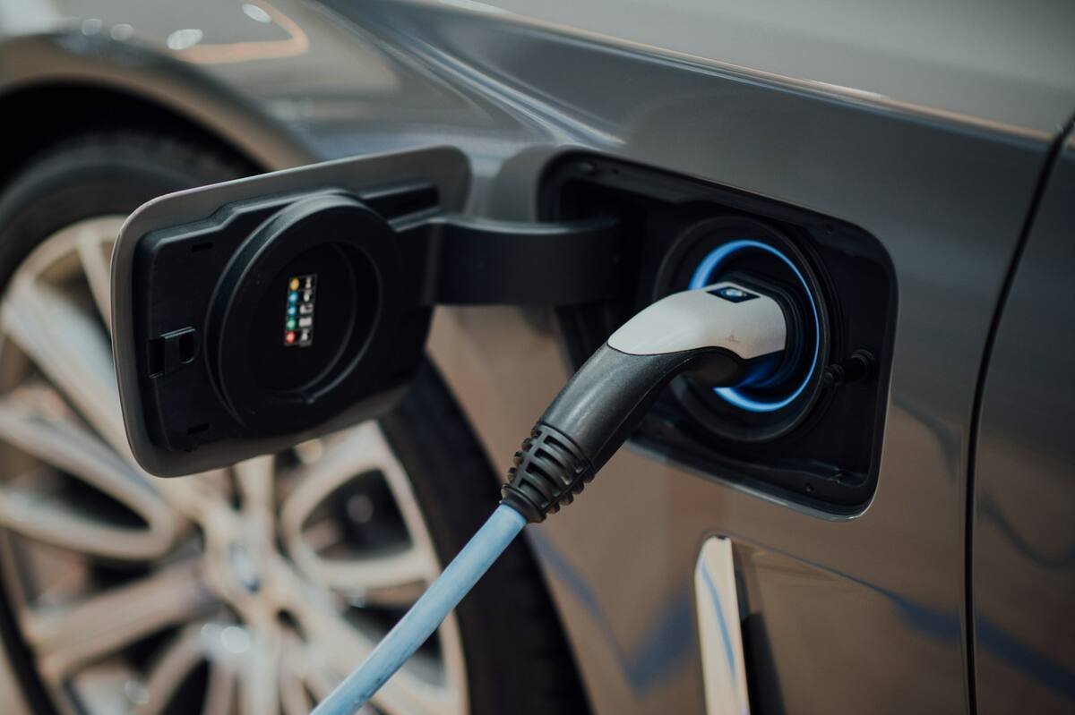 A charging cable plugged into an electric car